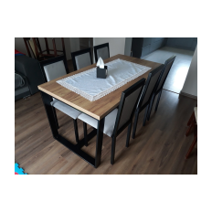 Metal table for the dining room with a wooden top together with metal chairs with upholstery