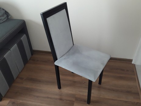 Upholstered metal chair - front view