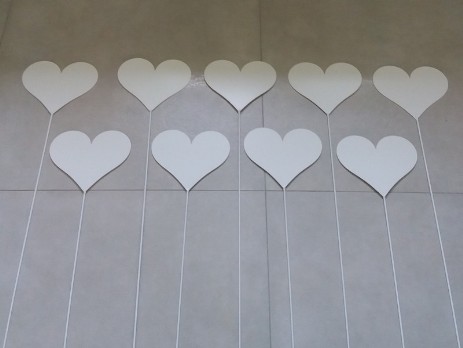 Painted metal hearts on rods