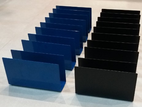 Black and blue napkin holders with solid walls