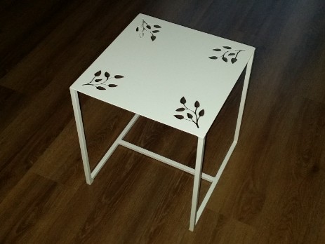 Metal table with metal decorative top