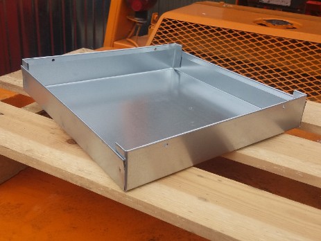 Galvanized tray mounted under the device