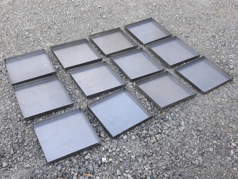 Welded trays of carbon steel sheet
