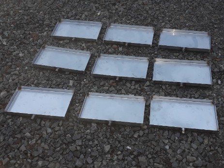 Stainless steel trays with drains